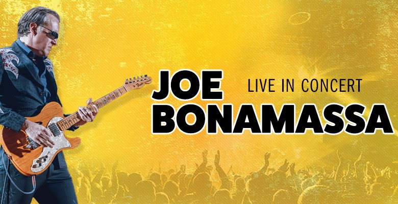 Image of Joe Bonamassa playing guitar with crowd silhouette in yellow background + name in text