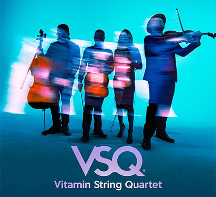 Blurry photo of Vitamin String Quartet musicians with instruments